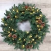 Meisterhome® Kerstkransen>Meisterhome Kerstkrans Van 50 Cm - Met Gratis Ophangbeugel En 50 Warmwitte Led's - Rode Bessen - Dennenappels